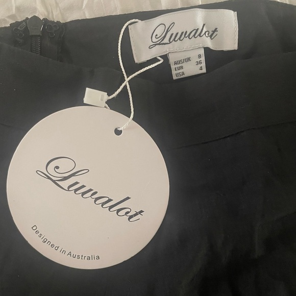 NWT Australian brand Luvalot black ruffle miniskirt with side zipper. 
Size 4 - Picture 4 of 5